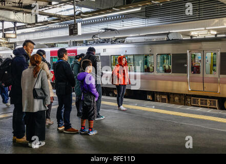 Hiroshima, Japan - Dec 28, 2015. People waiting for train in Hiroshima, Japan. Hiroshima was the first city targeted by a nuclear weapon, on August 6, Stock Photo
