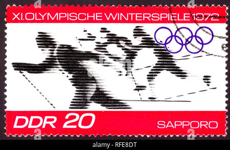 East Germany circa 1972:  Cancelled postage stamp printed in East Germany , that shows winter olympic skiing competition in Sapporo Japan 1972, circa  Stock Photo