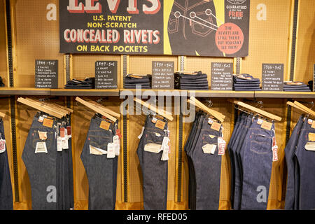An in store display of levi jeans hi-res stock photography and