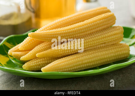 Dish with fresh cooked sweet yellow baby corn Stock Photo