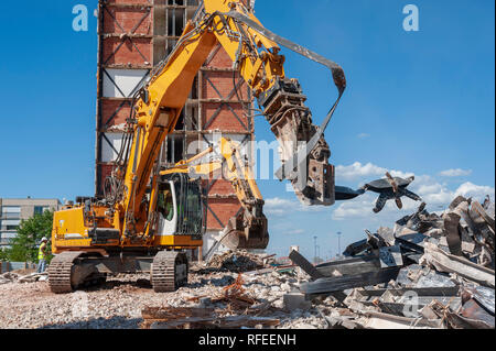 Demolition excavators equipped with steel shears in action. Stock Photo