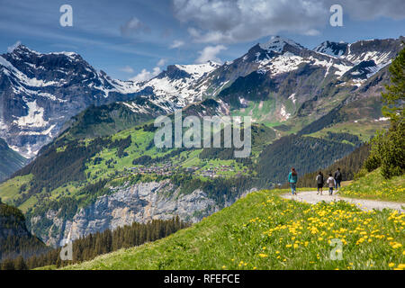 Switzerland, Alps, Berner Oberland, Spring. Grindelwald, Kleine Scheidegg. View of Weisse Lutschine valley. Hikers, asian family tourists. Stock Photo