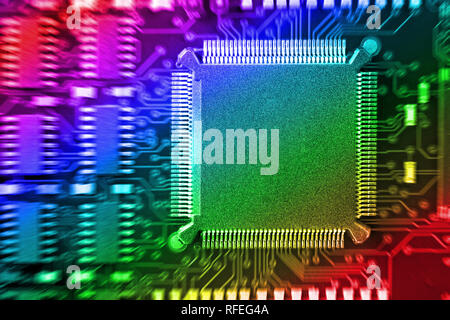 PCB Printed Circuit Board with many electrical components Stock Photo