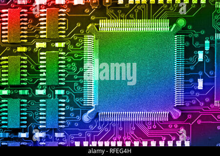 PCB Printed Circuit Board with many electrical components Stock Photo