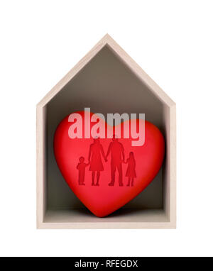 Wooden house and red heart with imprinted family shape isolated on white with clipping path Stock Photo