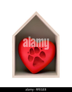 Wooden house and red heart with imprinted dog paw isolated on white with clipping path Stock Photo