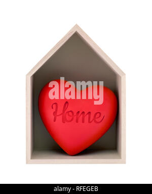Wooden house and red heart with imprinted word home isolated on white with clipping path Stock Photo