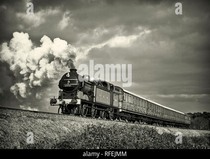 Ex GNR N2 class loco and a Gresley designed Quad-Art set of articulated suburban carriages recreate a commuter train from the mid-1920's. Stock Photo