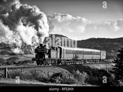 Ex GNR N2 class loco and a Gresley designed Quad-Art set of articulated suburban carriages recreate a commuter train from the mid-1920's. Stock Photo