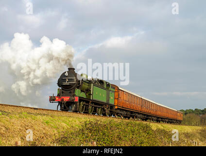 Ex GNR N2 class loco and a Gresley designed Quad-Art set of articulated suburban carriages recreate a commuter train from the mid-1920's. Stock Photo