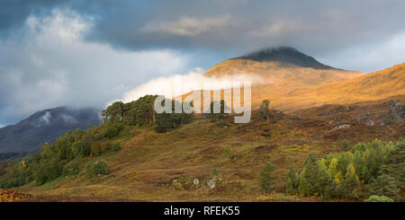 Early morning sunshine breaks through on Sgurr na Lapaich, Glen Affric, Scotland Stock Photo