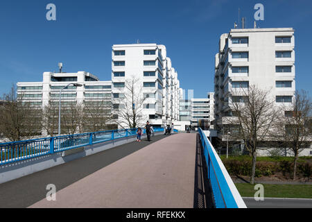 Footbridge to big white office buildings in the Netherlands Stock Photo