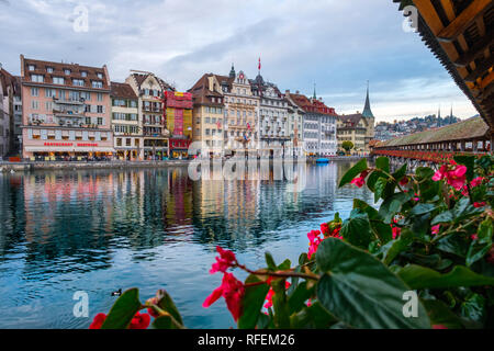 View from the Chapel Bridge of the historic city of Lucerne in autumn light Stock Photo