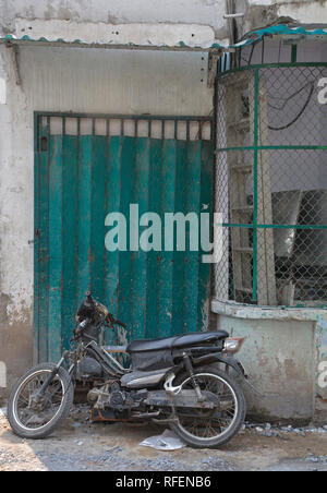 A doorway in a small residential back street in the Tran Hung Alleys area of District 1 in Saigon. Stock Photo