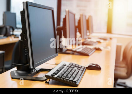 Empty computer room neatly placed for student in a computer lab. Stock Photo
