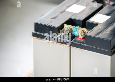 Old battery corrosion, seal lead acid battery damage. Stock Photo