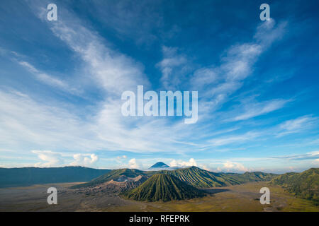 Bromo mountain , day time with dramatic cloud on blue sky Stock Photo