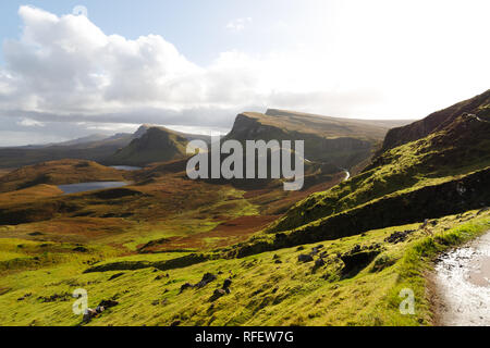 Hiking path at Quiraing with panorama view of Skye and its impressive mountains during a sunny autumn day (Isle of Skye, Scotland, Europe) Stock Photo