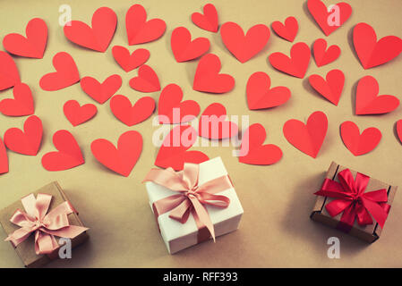 Flying red hearts concept of Valentines day. Top view flat lay. Decorated boxes with gifts Stock Photo