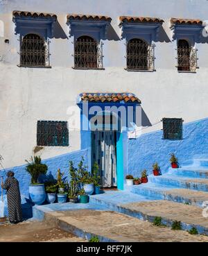 Facade, entrance with flower pots, blue house, medina of Chefchaouen, Chaouen, Tanger-Tétouan, Morocco Stock Photo