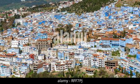 View on blue houses of the medina of Chefchaouen with Kasbah, Chaouen, reef mountains, Tangier-Tétouan, Morocco Stock Photo