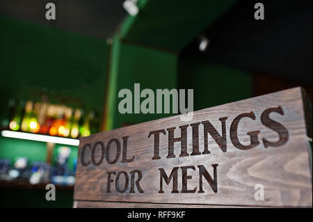 Cool things for men, sign on wood at barbershop. Stock Photo