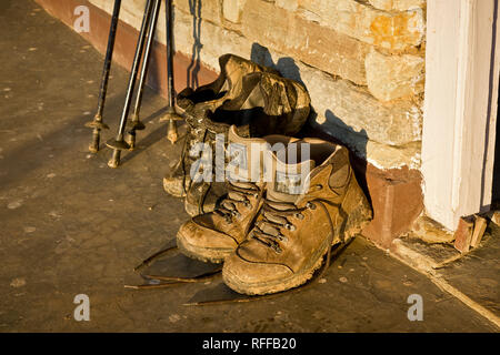 Dirty trekking boots Stock Photo