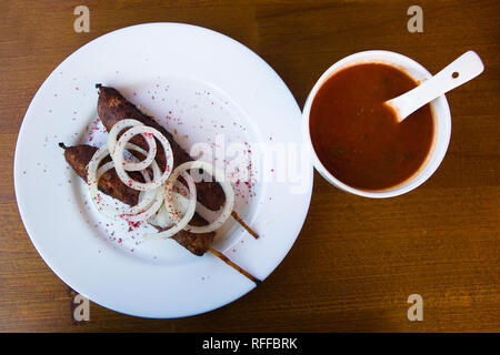 Lula kebab lie on a white plate. Food. Stock Photo