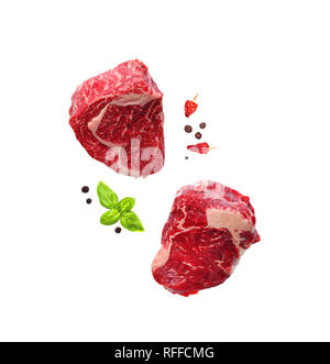 Raw marbled ribeye steaks isolated on white Stock Photo
