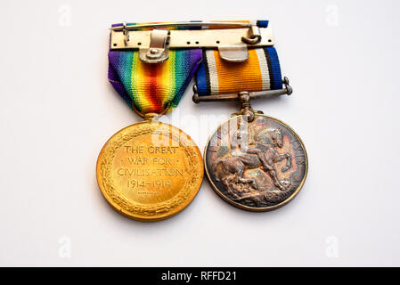 Great War war medals. British War Medal and Victory Medal. King George V. Campaign medal for UK and Allied forces from World War One. Ribbon bar Stock Photo