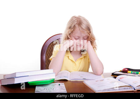 A girl stands under school stress Stock Photo