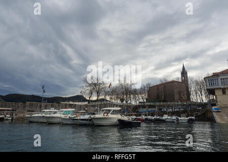 View of the harbor of the village of Mundaca in Vizcaya on a cloudy day, Spain Stock Photo