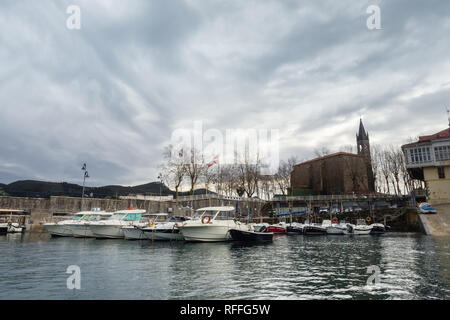 View of the harbor of the village of Mundaca in Vizcaya on a cloudy day, Spain Stock Photo