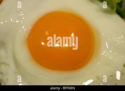 Closed up chicken egg yolk during fried on a pan Stock Photo