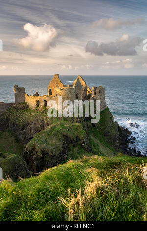 This is a picture of the ruins of Dunluce Castle in Northern Ireland.  It was built in the 13th century on the top of a sea cliff looking out to the A Stock Photo