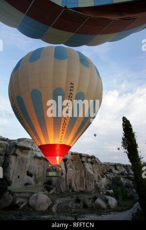 TUR Turkey Cappadocia Hot Air Ballooning over Cappadocia. Balloons of 'Kapadokya Balloons'. Pre-launching procedere Stock Photo