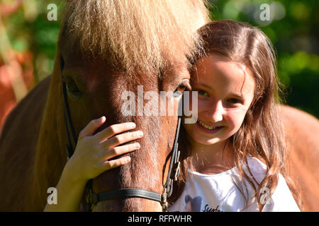 Girl with Icelandic Horse, gelding Stock Photo