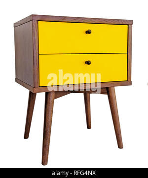 Yellow wood bedside table. Modern designer nightstand isolated on white background side view. cabinet with two drawers. Stock Photo