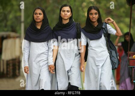 Young women in local Sari dresses, Fort Cochin, Kerala, India Stock Photo