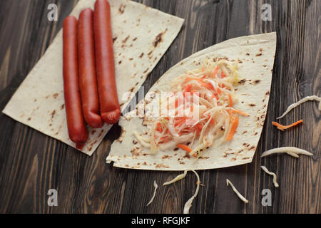 homemade sausage, pita bread and pickled cabbage for making Shawarma Stock Photo