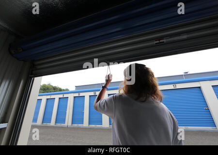 Self storage units with roller shutter doors Scotland self contained containers  pull down opening Stock Photo