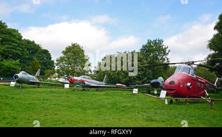 View of military aircraft, Lockheed T-33, and a Westland Whirlwind helicopter at the Norfolk and Suffolk Aviation Museum, Flixton, Suffolk, UK Stock Photo