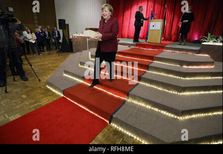 Trinwillershagen, Germany. 25th Jan, 2019. Angela Merkel (CDU), Federal Chancellor, leaves the stage after her speech at the traditional New Year's reception of the district of Vorpommern-Rügen. Merkel represents the constituency with a direct mandate in the Bundestag. Credit: Bernd Wüstneck/dpa/Alamy Live News Stock Photo