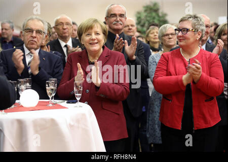 Trinwillershagen, Germany. 25th Jan, 2019. Angela Merkel (CDU, M), Federal Chancellor, applauds the other party members Wolfhard Molkentin (CDU, l), former District Administrator, and Werner Kuhn (CDU, 3.v.l), Member of the European Parliament, Andrea Köster (CDU, r), President of the District Council, at the traditional New Year's Reception of the District of Vorpommern-Rügen. Merkel represents the constituency with a direct mandate in the Bundestag. Credit: Bernd Wüstneck/dpa/Alamy Live News Stock Photo