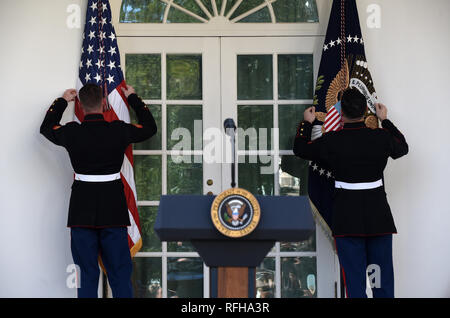 Washington, District of Columbia, USA. 25th Jan, 2019. Marines adjust the flags before an event in the Rose Garden of the White House January 25, 2019 in Washington, DC Credit: Olivier Douliery/CNP/ZUMA Wire/Alamy Live News Stock Photo