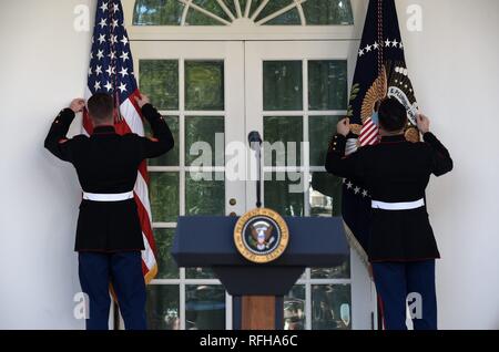 Washington, DC. 25th Jan, 2019. Marines adjust the flags before an event in the Rose Garden of the White House January 25, 2019 in Washington, DC. Credit: Olivier Douliery/Pool via CNP | usage worldwide Credit: dpa/Alamy Live News Credit: dpa picture alliance/Alamy Live News Stock Photo