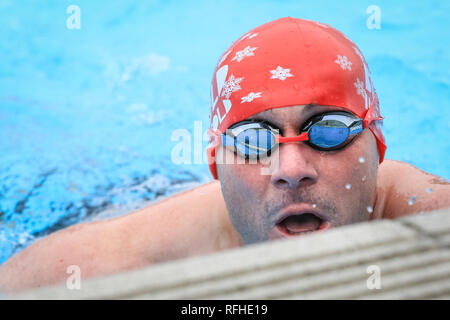 Tooting Bec, London, UK, 26th Jan 2019. A competitor feels the cold. The 8th UK Cold Water Swimming Championships get under way at Tooting Bec Lido in South London. Over 700 swimmers and dippers in various categories are cheered on by the crowds, including 30-yards traditional ‘head-up’ breaststroke, 30m ice fly, 90m freestyle dash and the ‘Big Splash’ Crisis charity jump-in with over 70 hardy dippers, in aid of the homeless charity.  degrees. Credit: Imageplotter News and Sports/Alamy Live News Stock Photo