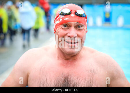 Tooting Bec, London, UK, 26th Jan 2019. A competitor feels the cold. The 8th UK Cold Water Swimming Championships get under way at Tooting Bec Lido in South London. Over 700 swimmers and dippers in various categories are cheered on by the crowds, including 30-yards traditional ‘head-up’ breaststroke, 30m ice fly, 90m freestyle dash and the ‘Big Splash’ Crisis charity jump-in with over 70 hardy dippers, in aid of the homeless charity.  degrees. Credit: Imageplotter News and Sports/Alamy Live News Stock Photo