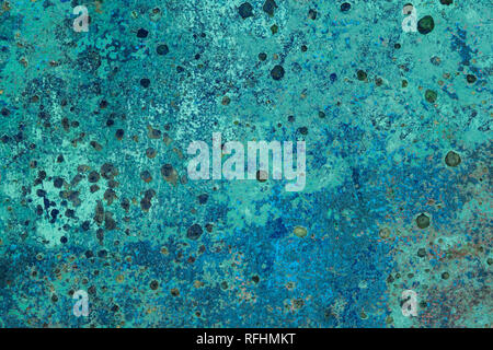 Metal corrosion patterns on an old turquoise painted boat, Ireland Stock Photo