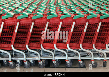 Shopping trolleys stacked in supermarket, Spain Stock Photo